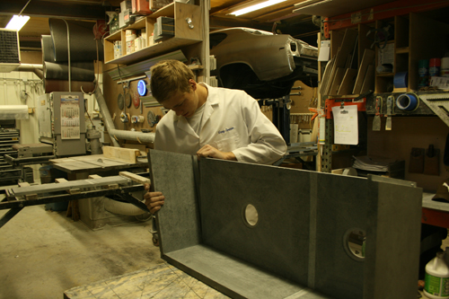 Greg Seuren putting on the second side of a soapstone sink